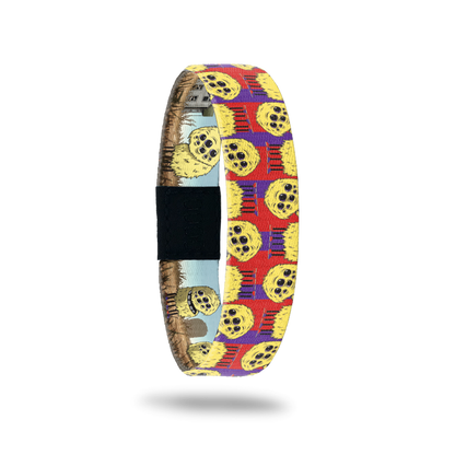 Product photo of the outside of 2021 - Day 12 - Tippi Taperoni: red and purple background with repeating yellow, furry monsters with multiple eyes and 6 legs with purple and red shoes