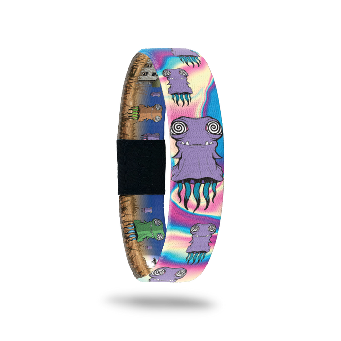 Bracelet is very colorful with blues, pinks and purples. A psychedelic design with a monster that has swirly eyes and tentacles. Comes with a matching monster pin.