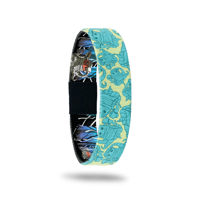 Teal and bright yellow design of a monster wrapped in toilet paper like a mummy. Comes with a matching monster pin.