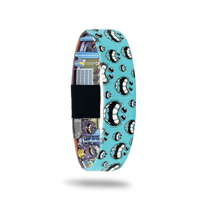 Teal bracelet with big laughing mouths all of the design. Comes with a monster pin with the same large laughing mouth.