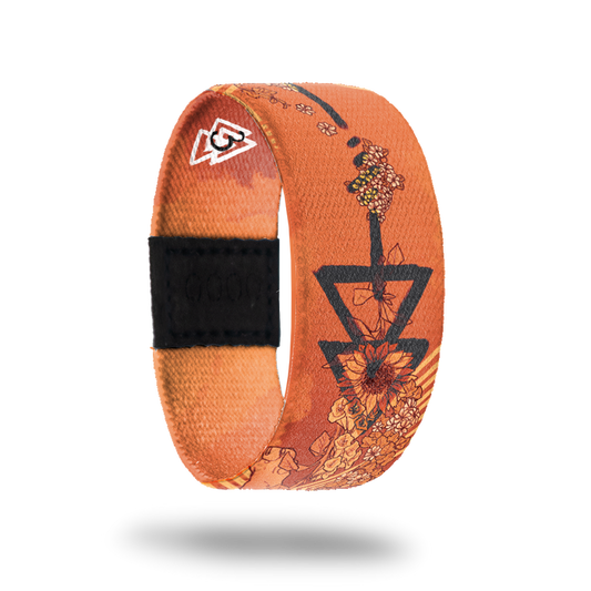 Animal-Sold Out-ZOX - This item is sold out and will not be restocked. Burnt orange with various sunflowers all over and black arrows. Inside is solid orange and says Animal.