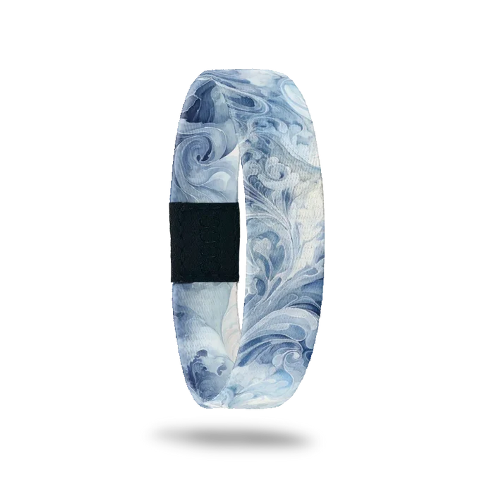 Blue and white swirl/smoke design all over. Inside is the same and reads Be The Storm.