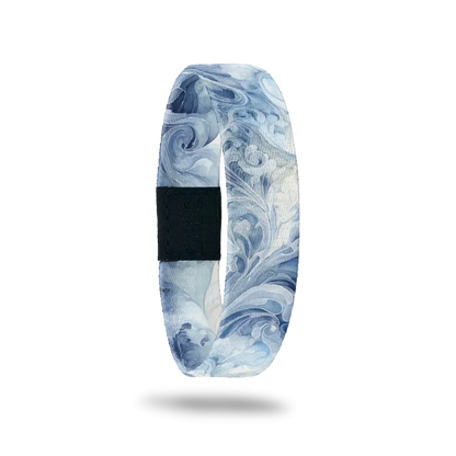 Blue and white swirl/smoke design all over. Inside is the same and reads Be The Storm.