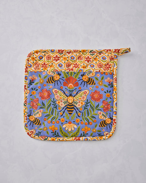 Bee Tapestry pot holder shown flat with a blue floral-and-bee center, cream floral-patterned border, and hanging loop.