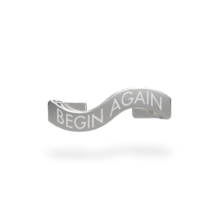 This is a charm that fits ZOX single wristbands, lanyards and hoodie strings only.  It is made from stainless steel and is silver in color. The words BEGIN AGAIN are etched in the metal.
