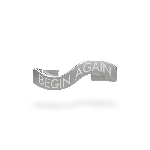 This is a charm that fits ZOX single wristbands, lanyards and hoodie strings only.  It is made from stainless steel and is silver in color. The words BEGIN AGAIN are etched in the metal.
