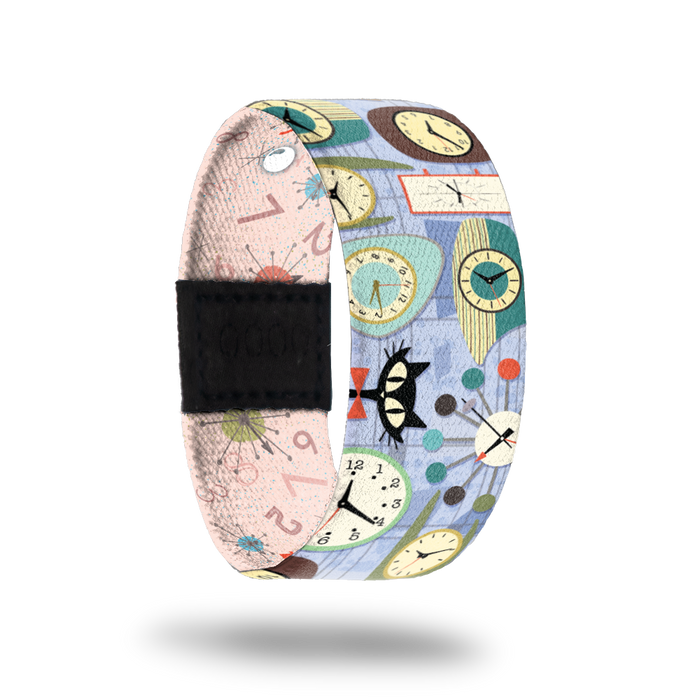 Pale blue strap with clocks and cats all over. Inside is pale pink with numbers and clocks all over and reads Better Late Than Never. Comes with a matching lapel pin and collector's box.