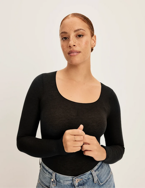 | Front view of model wearing the Cashmere Mist Scoop Top highlighting the neckline and fit | Black