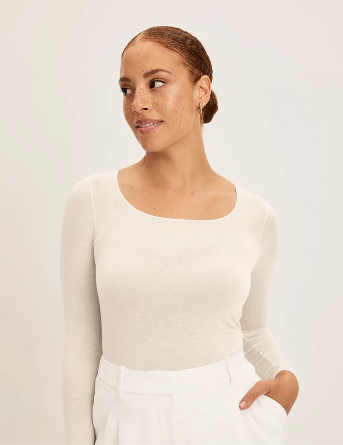 | Front view of model wearing the Cashmere Mist Scoop Top highlighting the neckline and fit | Ivory