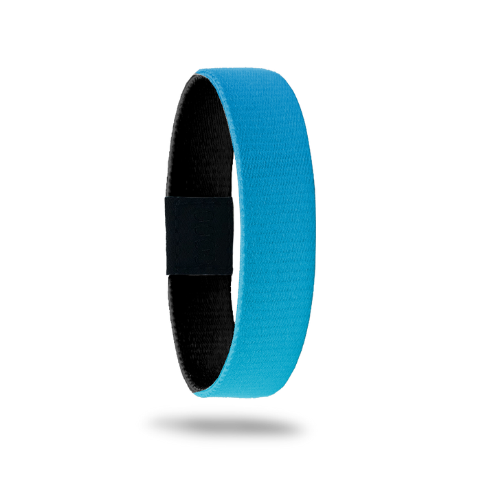 This is a reversible single and strap. The outside is sold blue gradient with nothing else. The inside is all black and says Caught Doing Good.  The kids' version has two handprints on the inside.
