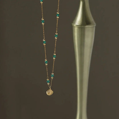 Delicate Gold-Plated Shell Pendant Necklace with Green Glass Beads Crushes.