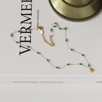 Delicate Gold-Plated Shell Pendant Necklace with Green Glass Beads Crushes.