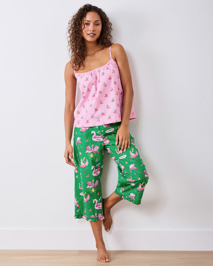 Full-length front view of the pink flamingo-print cami and green ruffled cropped pajama pants
