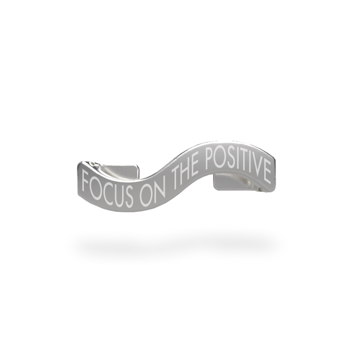This is a charm that fits ZOX single wristbands, lanyards and hoodie strings only. It is made from stainless steel and is silver in color. The words FOCUS ON THE POSITIVE are etched in the metal.