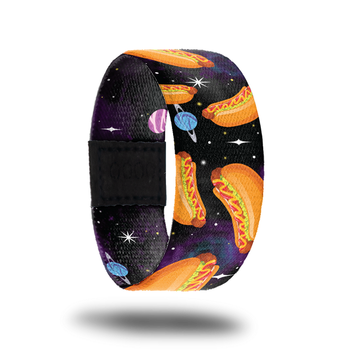 Outside design of Franks In Space. Dark space background with a few small illustrated planets and larger cartoon illustrated hotdogs with condiments spread across randomly