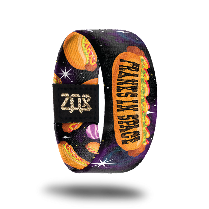 Inside design of Franks In Space. Large cartoon illustrated hotdog in the center with Franks In Space in black text on the bun over a dark space background