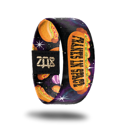 Inside design of Franks In Space. Large cartoon illustrated hotdog in the center with Franks In Space in black text on the bun over a dark space background