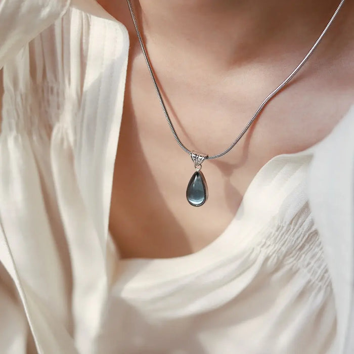 Gold-Plated Teardrop Pendant Necklace with Blue Synthetic Cat Eye Stone Crushes.