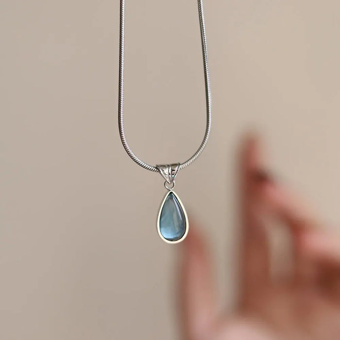 Gold-Plated Teardrop Pendant Necklace with Blue Synthetic Cat Eye Stone Crushes.