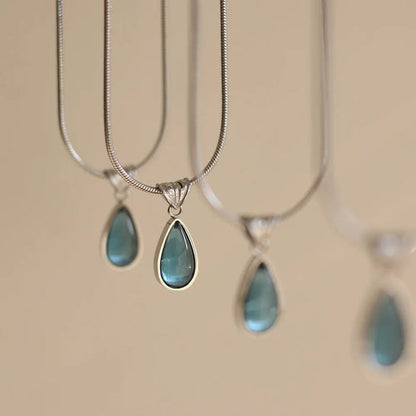 Gold-Plated Teardrop Pendant Necklace with Blue Synthetic Cat Eye Stone Crushes.
