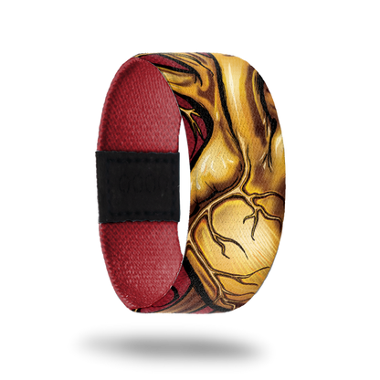 Dark red wristband with gold, lifelike heart drawing on outside.