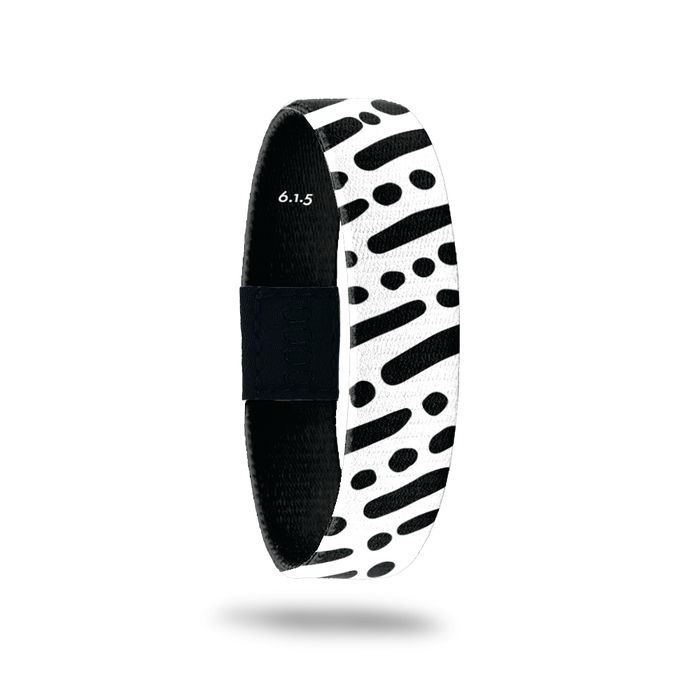 Wristband single is black and white lines and dots in a diagonal pattern. The inside is the same and reads I Am With You Always with the Bible verse 6.1.5.