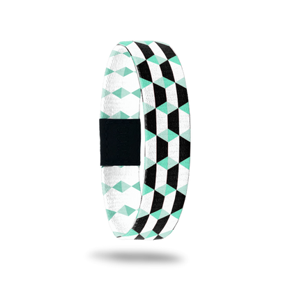 Black, white and mint colored parallelograms all over the design. Inside is the same but in mint and white and says Just Breathe.