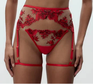 Red floral lingerie set on a model against a white background