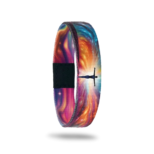 Wristband single is a multicolored gradient that resembles sun rays or a nebula design. In the center of the rays is the sillhouette of a human with arms outstretched and glowing. The inside is the same and reads Leap Of Faith.