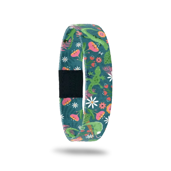 Wristband single is a dark green base. The design is bright green lizards in a mix of pink nd oranges flowers and vines.  The inside is the same and reads Leaping Lizards.