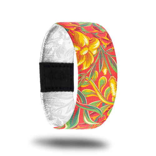 Outside design of Life Is A Gift. Orange-red background with golden colored flowers and green leafs and green stems