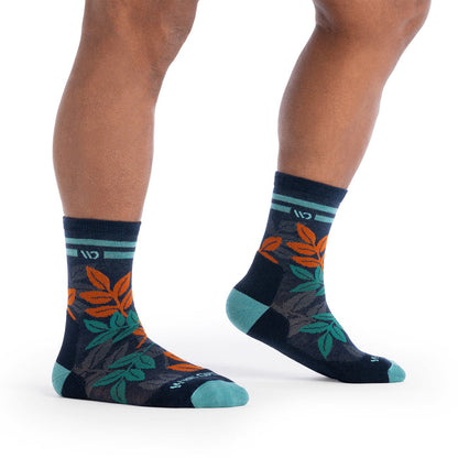 on model image with feet pointing to the side with one foot raised wearing the 9009 island time in eclipse