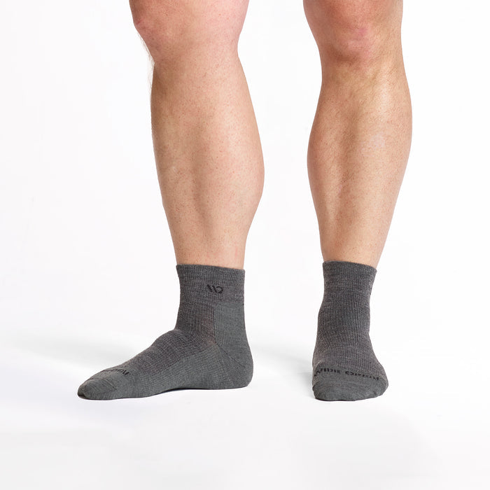 model feet with left foot to the side wearing the 9014 lightweight quarter sock in gray