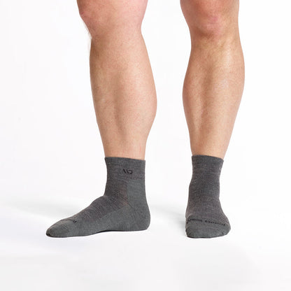 model feet with left foot to the side wearing the 9014 lightweight quarter sock in gray