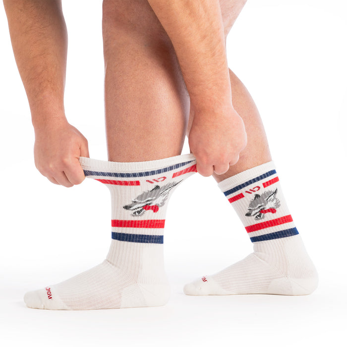 on model image with model stretching the cuff of the 9007 varsity cushioned crew in wolf white