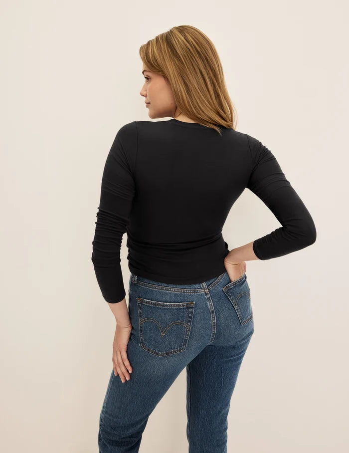 | Back view of model wearing the Modal Rib Long Sleeve highlighting the coverage and fit | Black