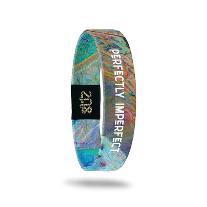 Product photo of the inside of perfectly imperfect. It is aerial of photoshopped image of earth that has a blue, purple, green, yellow and orange marble look with a white text perfectly imperfect overlaying.