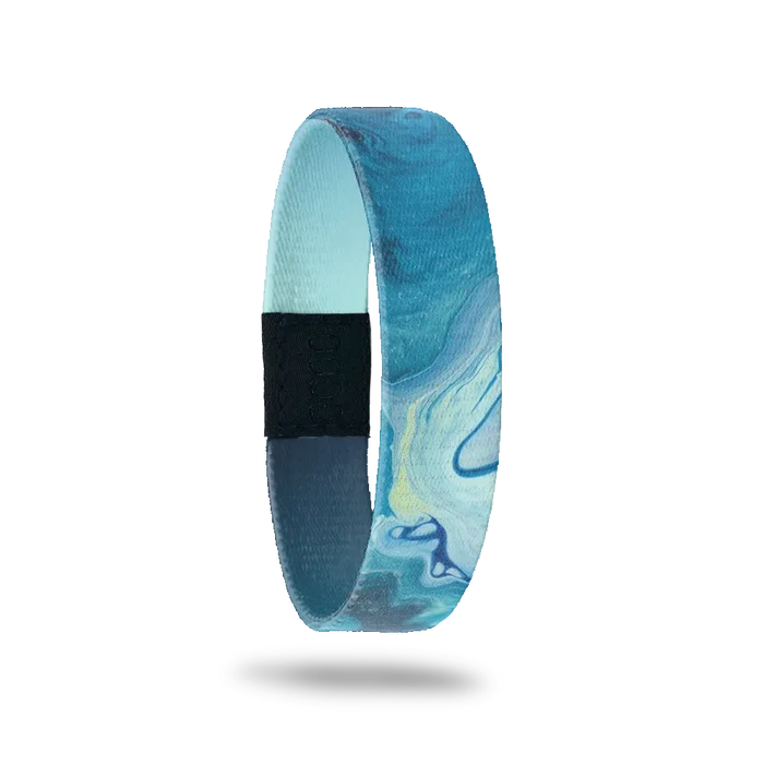 Wristband single that is variations of blue color and looks like watercolor swirls. The inside is blue/nacy gradient and reads Persevere.