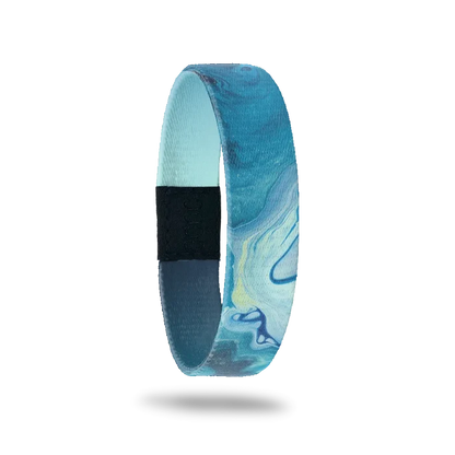 Wristband single that is variations of blue color and looks like watercolor swirls. The inside is blue/nacy gradient and reads Persevere.