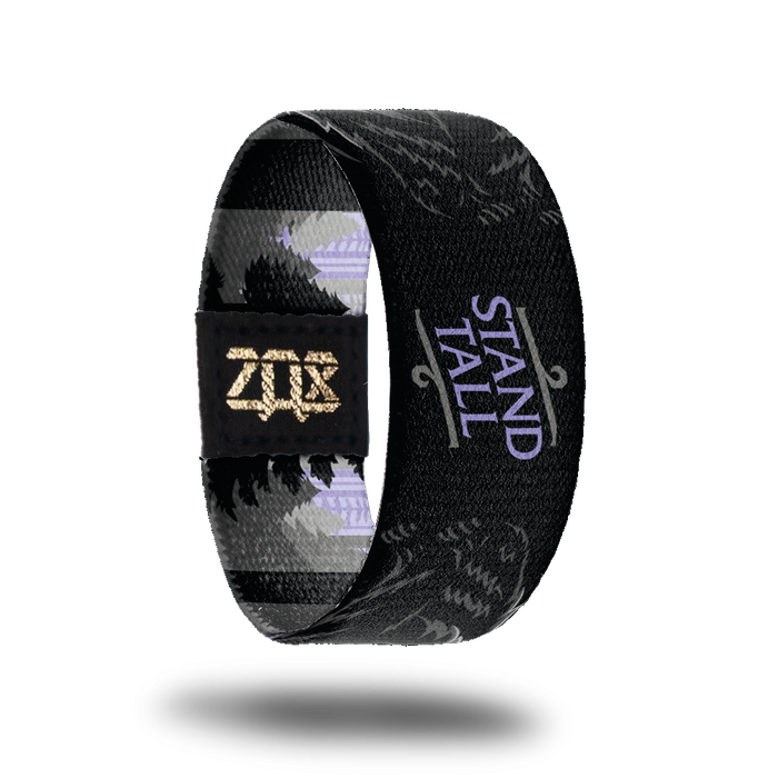 Inside Design of Stand Tall: black background with purple text in the middle 'stand tall' and two standing black bears on the sides of the text