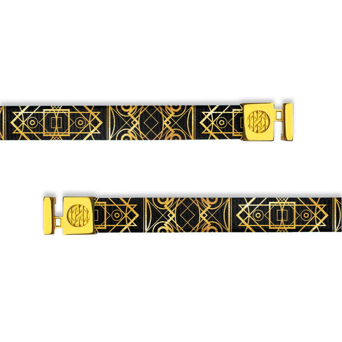 Flat hoodie string. Design is a black background with gold accents and fine line designs. Inside reads "Us Against The World" and the aglets are gold.
