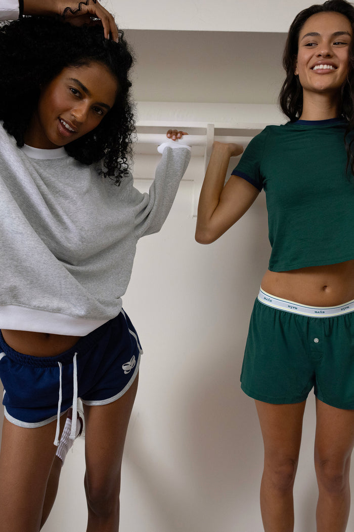 Fenet is 5'9" and 32D, wearing S on top and XS on the bottom; Gabbie is 5’11” and 34B, wearing XS