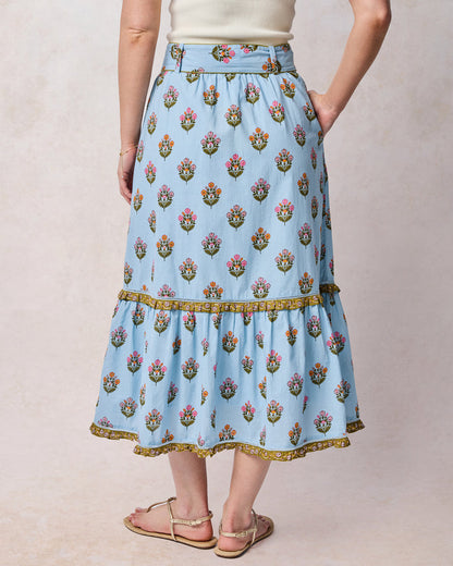 Back view of soft blue floral Emmie skirt with a wide waistband and gathered lower tier