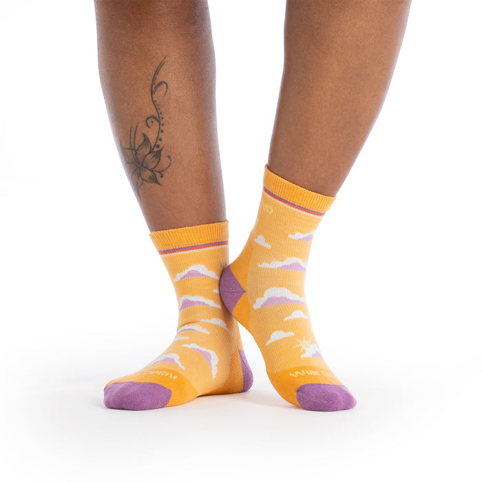 on model image wearing the 9508 cloud hopper cushioned micro crew in sunset