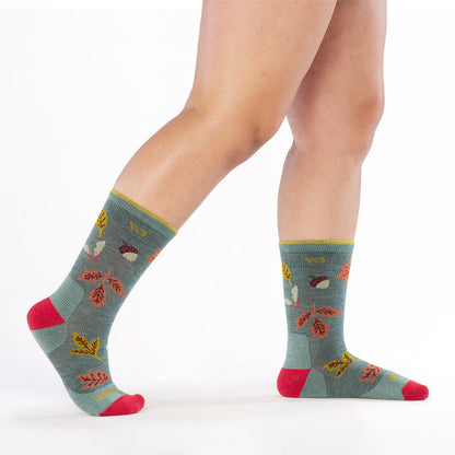 model walking to the right with back foot lifted wearing the 9511 fall in love cushioned crew in seafoam