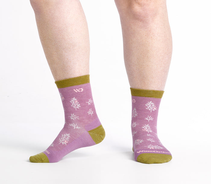 One foot to the side Micro Crews on model with gold heel/toe/cuff, Pink body and white design
