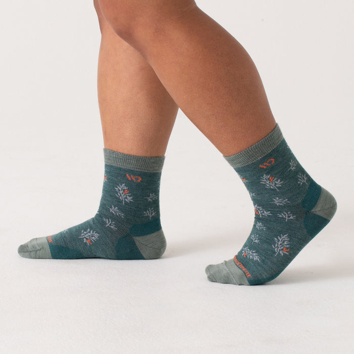 On body of seafoam heel/toe/cuff, teal body, white pattern with orange accents --Teal