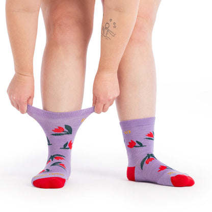 on model image with the cuff being stretched on one foot wearing the 9507 full bloom in tulip purple
