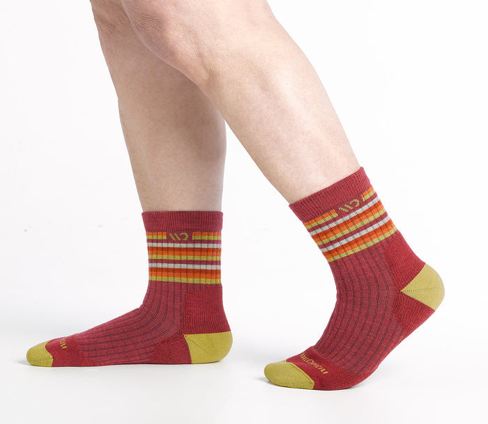 Walking to the side Micro Crew on body with Yellow heel/toe, cranberry body and Stripes below the cuff