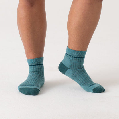 On model Quarters with dark teal heel/toe and logo, with light teal body--Light Teal